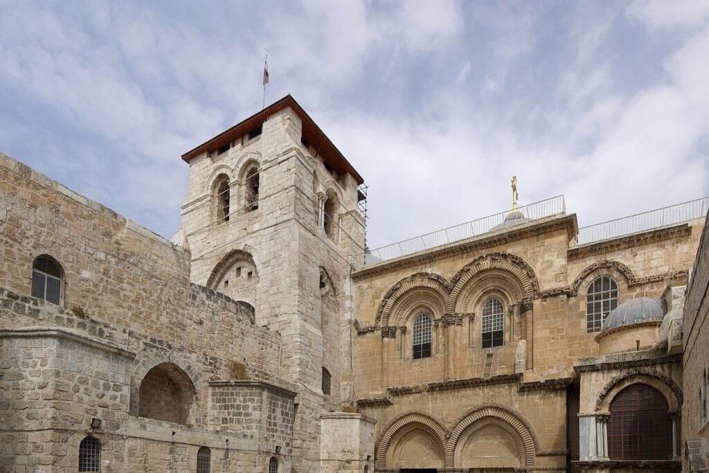 Courtyard and facade of the Church of the Holy Sepulchre with its bell tower