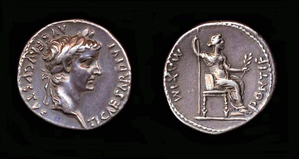 Silver coin with the head of Tiberius and a seated female figure
